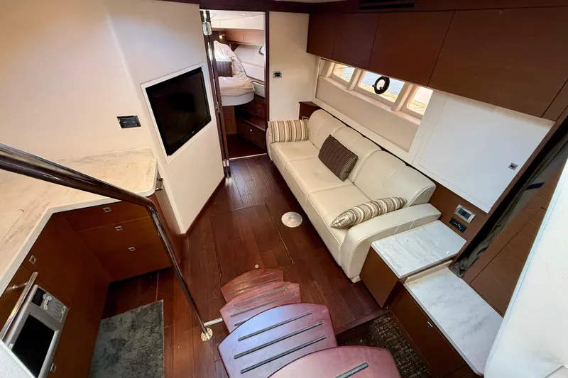 Slide: The Image of Luxurious interior of 2012 Sea Ray 410 Sundancer yacht with modern furnishings. - 18