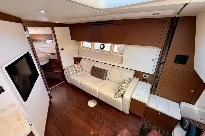 Slide: The Image of Luxurious interior of 2012 Sea Ray 410 Sundancer yacht with modern furnishings. - 20