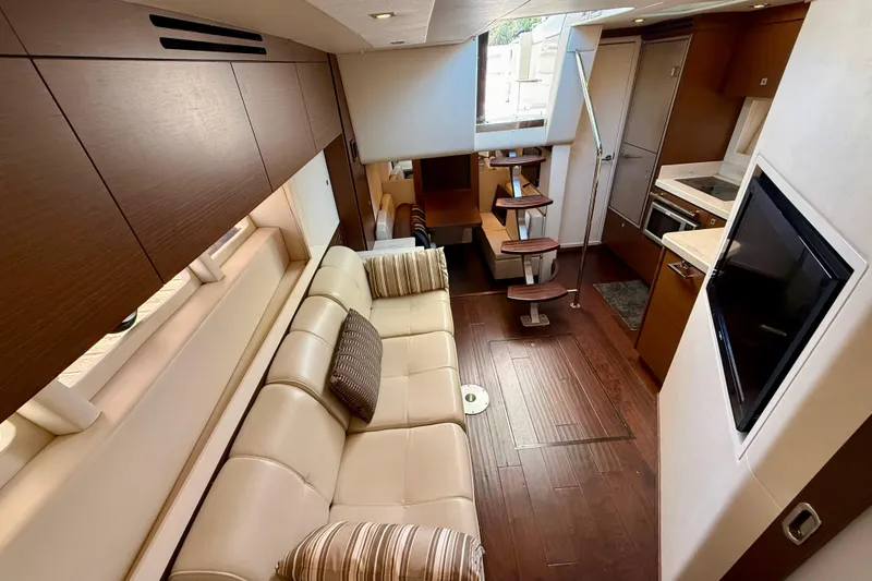 Slide: The Image of Luxurious interior of 2012 Sea Ray 410 Sundancer yacht with modern furnishings. - 26