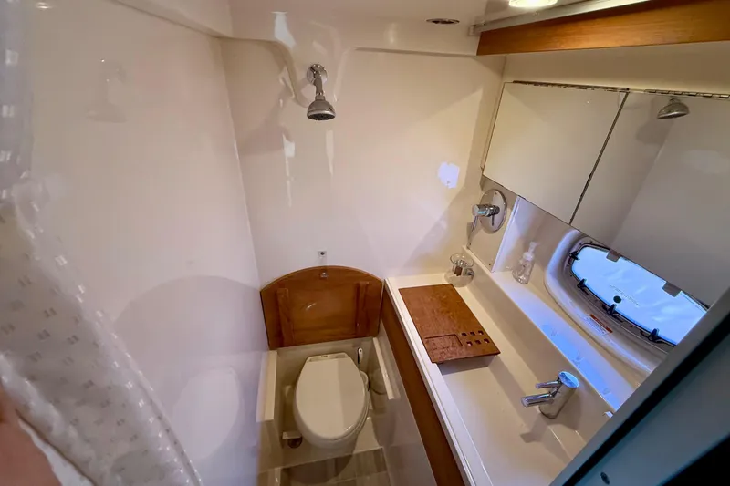 Slide: The Image of Luxurious bathroom interior of 2012 Sea Ray 410 Sundancer yacht with modern fixtures. - 27