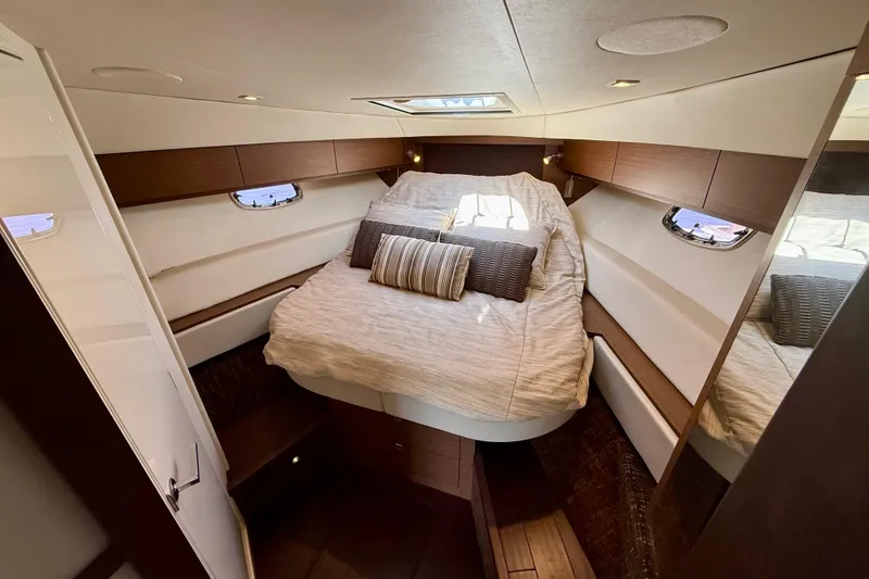 Slide: The Image of Luxurious cabin interior of 2012 Sea Ray 410 Sundancer yacht with cozy bed and elegant design. - 28