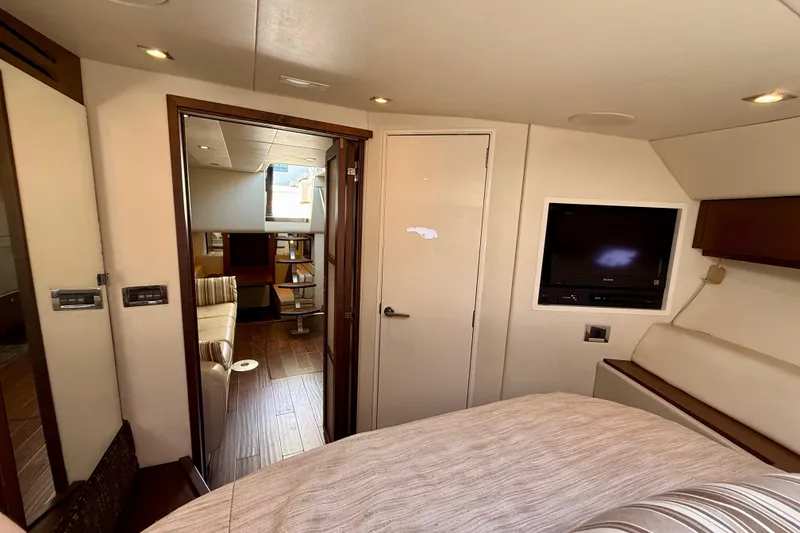 Slide: The Image of Interior of 2012 Sea Ray 410 Sundancer yacht, featuring cozy cabin and modern amenities. - 29