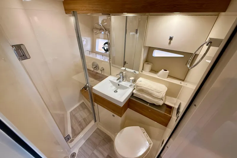 Slide: The Image of Luxurious bathroom in 2012 Sea Ray 410 Sundancer yacht, featuring modern fixtures and elegant design. - 30