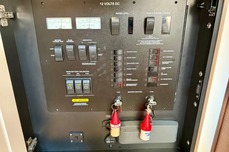 Slide: The Image of Electrical control panel of a 2012 Sea Ray 410 Sundancer boat. - 32