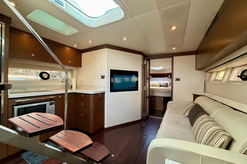 Slide: The Image of Luxurious interior of 2012 Sea Ray 410 Sundancer yacht with modern amenities and elegant design. - 36