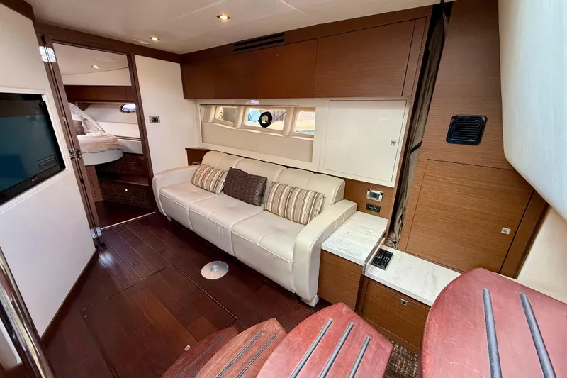 Slide: The Image of Luxurious interior of 2012 Sea Ray 410 Sundancer yacht with elegant seating and wood finishes. - 37