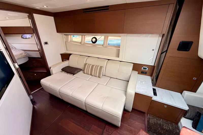 Slide: The Image of Luxurious interior of 2012 Sea Ray 410 Sundancer yacht with beige leather sofa. - 38