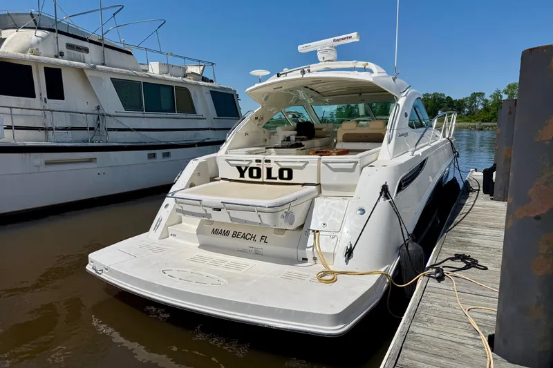 Slide: The Image of 2012 Sea Ray 410 Sundancer yacht docked at Miami Beach marina. - 4