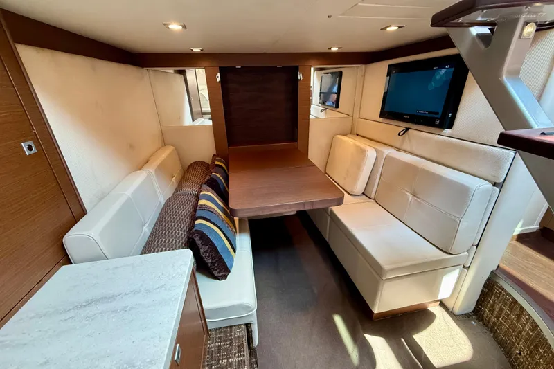 Slide: The Image of Luxurious interior of 2012 Sea Ray 410 Sundancer yacht with cozy seating and modern amenities. - 40
