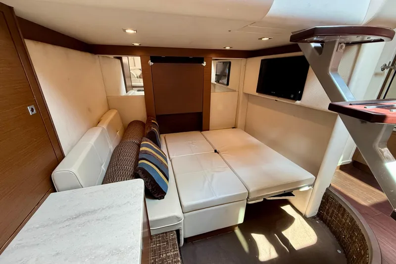 Slide: The Image of Luxurious interior of 2012 Sea Ray 410 Sundancer yacht with cozy seating and modern decor. - 41