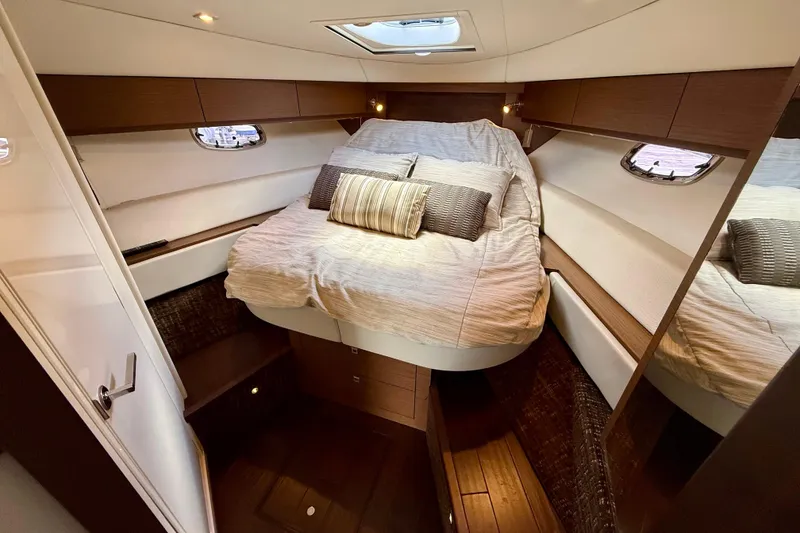 Slide: The Image of Luxurious cabin interior of 2012 Sea Ray 410 Sundancer yacht with cozy bed and elegant design. - 44