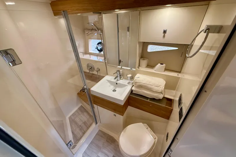 Slide: The Image of Luxurious bathroom interior of 2012 Sea Ray 410 Sundancer yacht with modern amenities. - 49