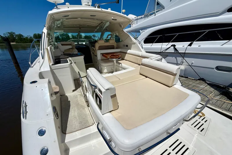 Slide: The Image of 2012 Sea Ray 410 Sundancer yacht with spacious deck and luxurious seating. - 9