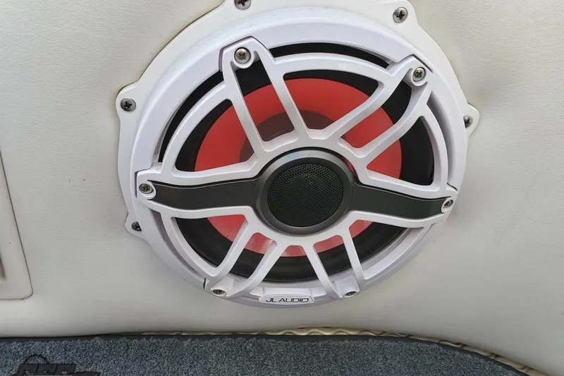 Slide: The Image of JL Audio speaker on a 2001 Cigarette 42' Tiger boat, featuring a white and red design. - 105