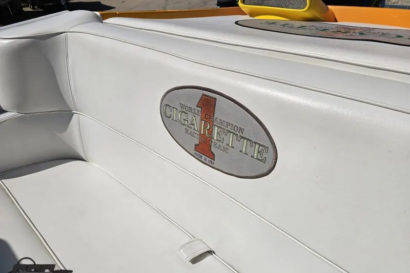 Slide: The Image of White leather seating with "Cigarette Racing Team" logo on a 2001 Cigarette 42' Tiger boat. - 107