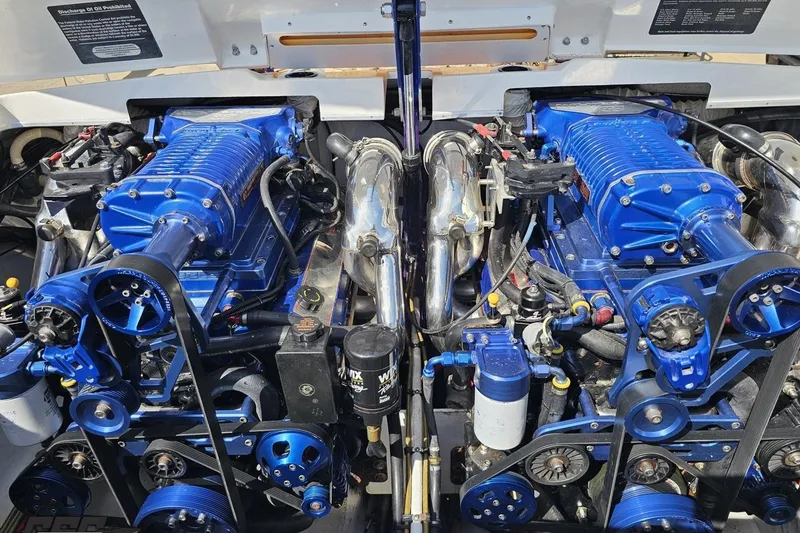 Slide: The Image of Twin blue engines in a 2001 Cigarette 42' Tiger boat. - 111