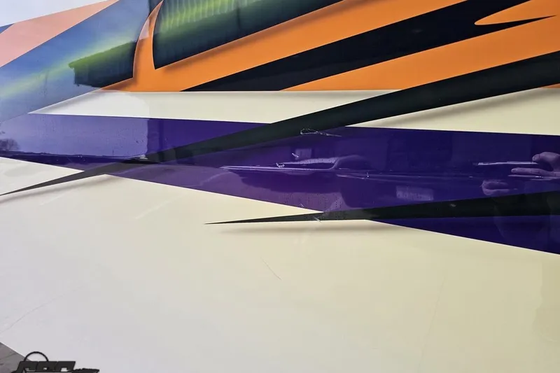 Slide: The Image of Colorful abstract design on 2001 Cigarette 42' Tiger boat exterior. - 118