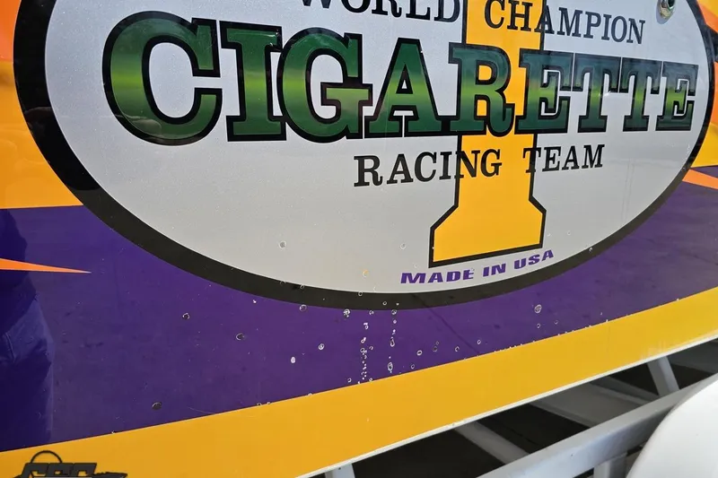 Slide: The Image of Cigarette Racing Team logo on 2001 Cigarette 42' Tiger boat, vibrant colors. - 122