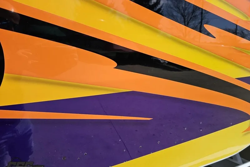 Slide: The Image of Colorful abstract design on 2001 Cigarette 42' Tiger boat hull. - 123