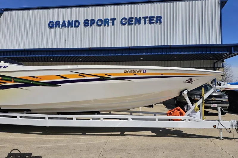 Slide: The Image of 2001 Cigarette 42' Tiger boat on trailer at Grand Sport Center. - 14