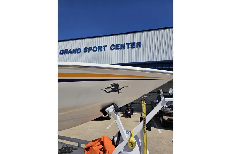 Slide: The Image of 2001 Cigarette 42' Tiger boat at Grand Sport Center, parked on a trailer. - 16