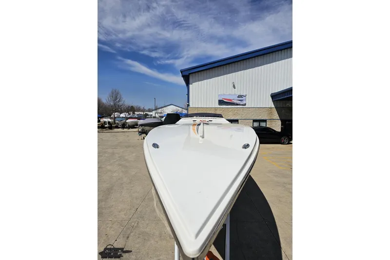 Slide: The Image of 2001 Cigarette 42' Tiger boat in a marina, clear sky background. - 17