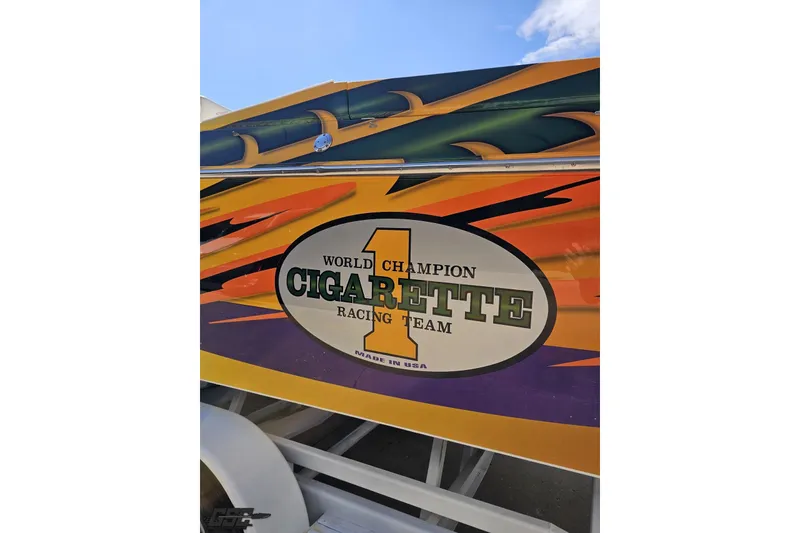 Slide: The Image of 2001 Cigarette 42' Tiger boat with vibrant racing graphics and "World Champion" logo. - 34