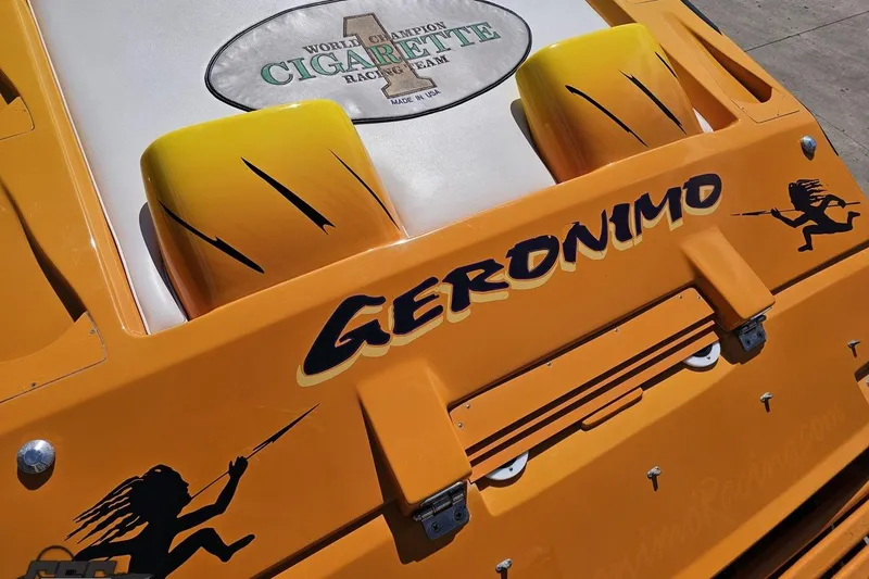 Slide: The Image of Orange 2001 Cigarette 42' Tiger boat with "Geronimo" and racing graphics. - 46