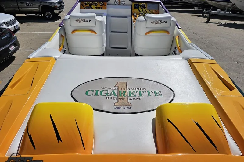 Slide: The Image of 2001 Cigarette 42' Tiger boat interior with racing team logo, yellow and white seating. - 50