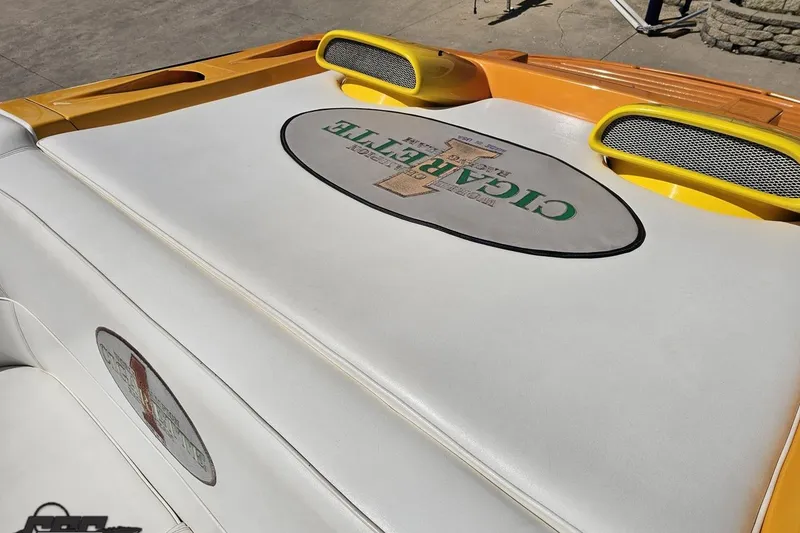 Slide: The Image of 2001 Cigarette 42' Tiger boat interior with branded upholstery and yellow accents. - 58