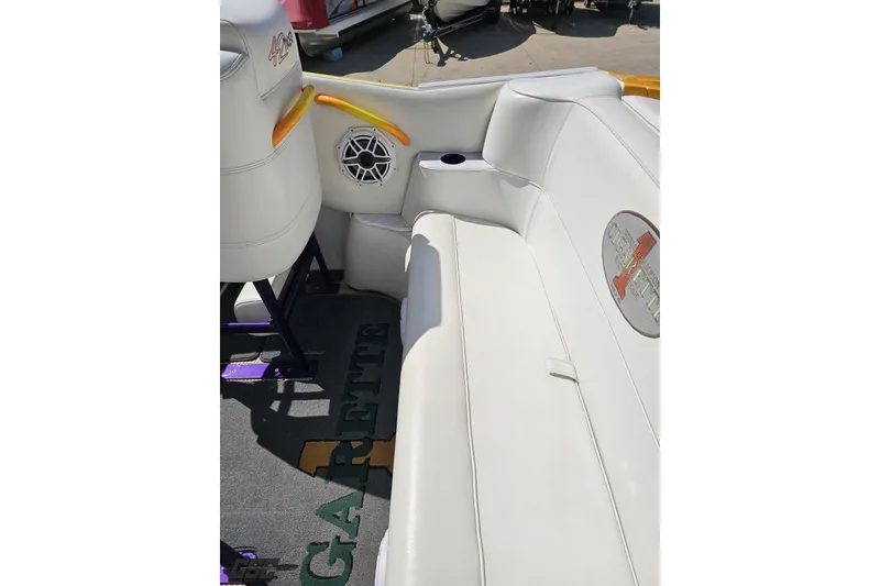 Slide: The Image of Interior of a 2001 Cigarette 42' Tiger boat with white seating and speaker. - 59