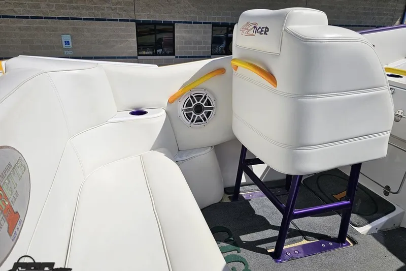 Slide: The Image of Interior of a 2001 Cigarette 42' Tiger boat with white seating and speaker. - 61