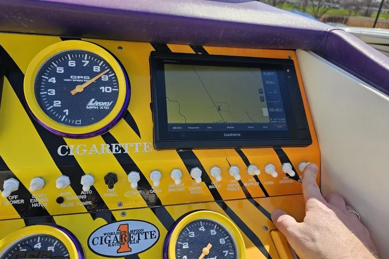 Slide: The Image of Dashboard of a 2001 Cigarette 42' Tiger boat with GPS and controls. - 70