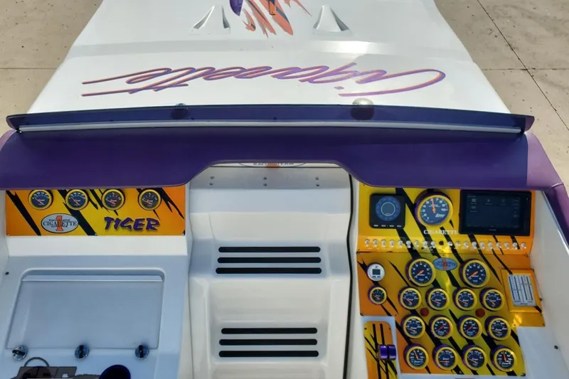 Slide: The Image of Dashboard of a 2001 Cigarette 42' Tiger boat with vibrant gauges and controls. - 75