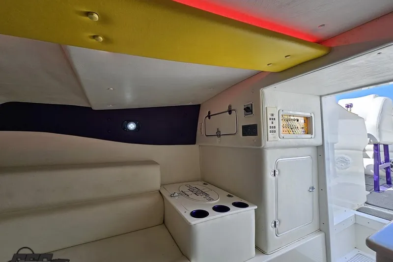 Slide: The Image of Interior of a 2001 Cigarette 42' Tiger boat, featuring seating and control panel. - 87