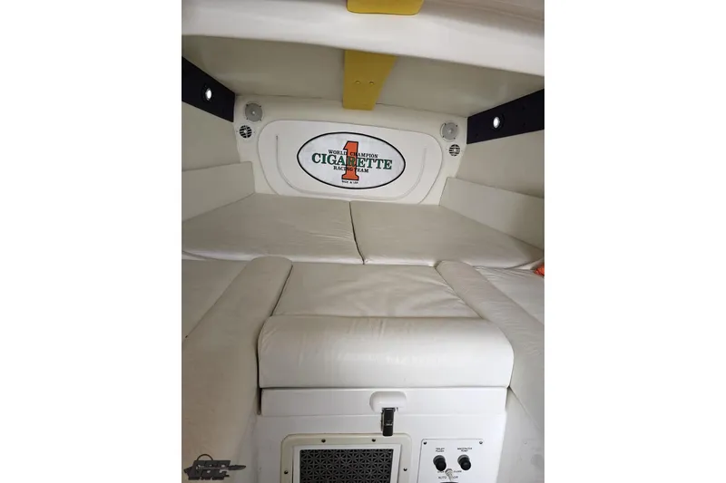 Slide: The Image of Interior cabin of 2001 Cigarette 42' Tiger boat with white leather seating. - 89