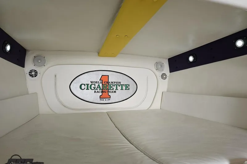 Slide: The Image of Interior cabin of 2001 Cigarette 42' Tiger boat with branded logo and lighting. - 91