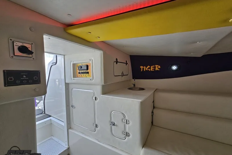 Slide: The Image of Interior of 2001 Cigarette 42' Tiger boat with seating and control panels. - 94