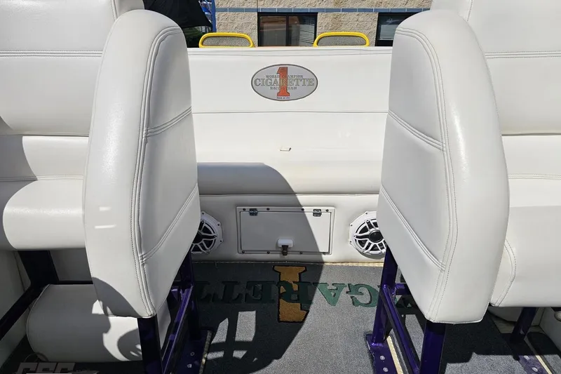Slide: The Image of Interior of a 2001 Cigarette 42' Tiger boat with white seating and logo. - 98