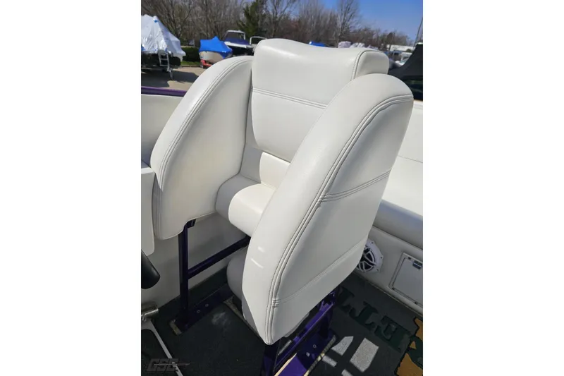 Slide: The Image of White leather seat on 2001 Cigarette 42' Tiger boat, outdoor setting. - 99