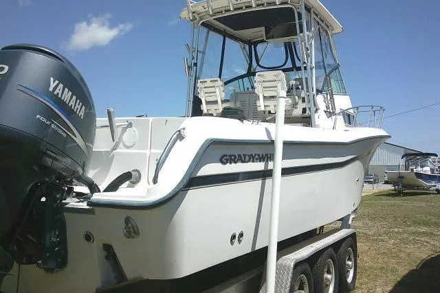 Slide: The Image of 2000 Grady-White Sailfish 272 boat with Yamaha outboard motor on trailer. - 11