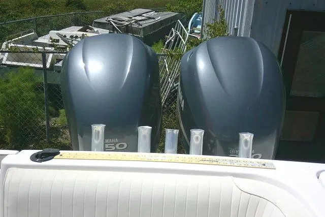 Slide: The Image of Twin Yamaha 150 outboard motors on a 2000 Grady-White Sailfish 272 boat. - 13