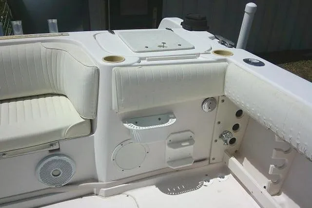 Slide: The Image of Interior view of a 2000 Grady-White Sailfish 272 boat, featuring seating and control panel. - 14