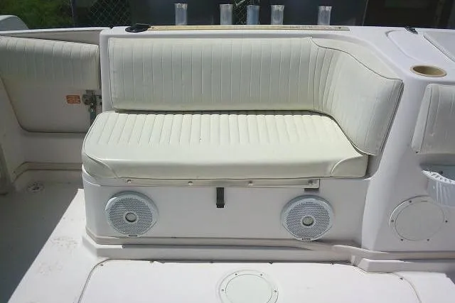 Slide: The Image of Grady-White Sailfish 272 (2000) boat seating area with speakers and cup holders. - 15