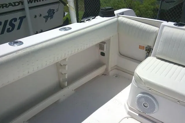 Slide: The Image of Interior of a 2000 Grady-White Sailfish 272 boat, featuring seating and storage. - 16