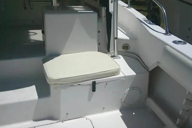 Slide: The Image of Grady-White Sailfish 272 (2000) boat interior with cushioned seating and white finish. - 17
