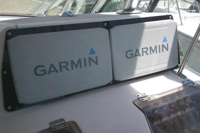 Slide: The Image of Garmin navigation screens on a 2000 Grady-White Sailfish 272 boat dashboard. - 32
