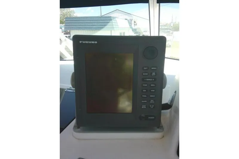 Slide: The Image of Furuno marine navigation system on 2000 Grady-White Sailfish 272 boat dashboard. - 33