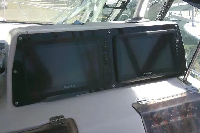Slide: The Image of Dashboard of 2000 Grady-White Sailfish 272 with dual Garmin navigation screens. - 34
