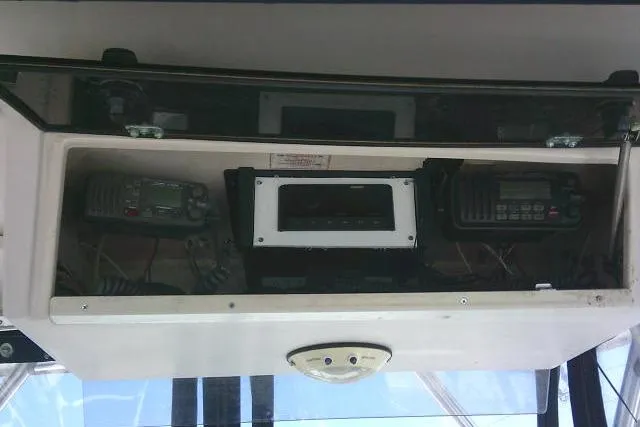 Slide: The Image of Overhead console of 2000 Grady-White Sailfish 272 with marine electronics. - 37